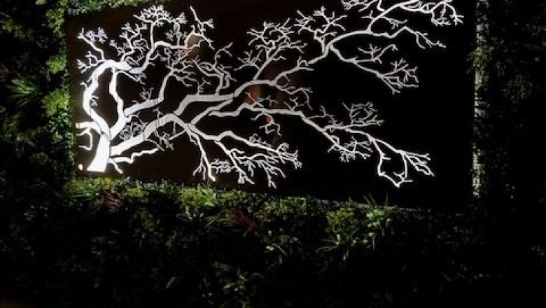 How to Style Outdoor Walls with Lush Spring Green Panels and LED Art